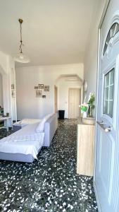 a hotel room with a bed and a door at Ammos beachfront apartment! in Kardamaina