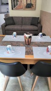 a table with two chairs in a living room at Gi&Sa in Gallipoli +29 photos