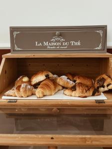 a display case with a bunch of pastries on a shelf at Residenza Sciarra B&B in Rome