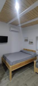 A bed or beds in a room at Goliva las Rosas