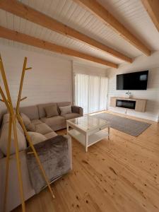 a living room with a couch and a table at Casa privada con piscina en Sanlúcar in Sanlúcar de Barrameda