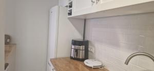 Kuchyň nebo kuchyňský kout v ubytování Machico Heart Suites