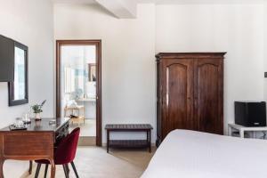 TV a/nebo společenská místnost v ubytování B&B La terrazza sul mare