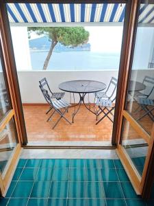 a view of a patio with a table and chairs at In Vacanza a Gaeta - Villa Nelda in Gaeta