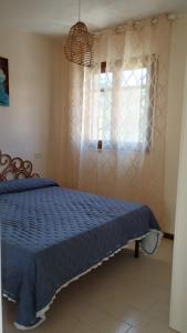 Postel nebo postele na pokoji v ubytování la torretta casale grandangolo