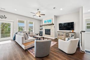 a living room with a fireplace and a tv at North Myrtle Beach Home - Walk to the Ocean! in Myrtle Beach