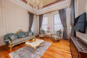 a living room with a couch and a table at Ring Stone Hotels Old City in Istanbul