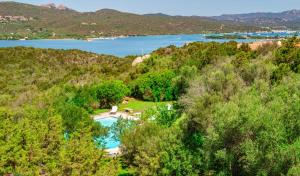 an aerial view of a hill with a body of water at Borgo Rudalza Villas & Apartments in Olbia
