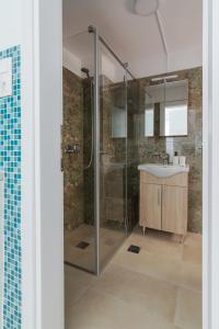 a bathroom with a shower and a sink at Athens Centre Acropolis "Loft" apartment #516 in Athens