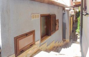 a building with two windows on the side of it at Casa Morgana in Scilla