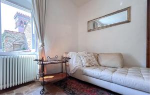 a living room with a couch and a window at 1 Bedroom Nice Home In Sansepolcro in Sansepolcro