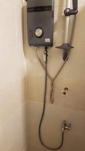 a shower in a bathroom with a shower at Loidas Place in Talisay