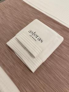 a white napkin sitting on top of a table at Asteras Mini Suites in Naousa