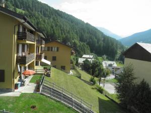 a view of a house with a mountain in the background at Bormio Flat in Bormio