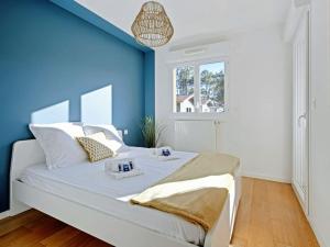 Ένα ή περισσότερα κρεβάτια σε δωμάτιο στο Nahia premium apartment with parking, by Hossegor Lake & ocean