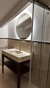 a bathroom with a sink and a mirror at Palazzo San Rocco Residenza Gentilizia in Sperlonga
