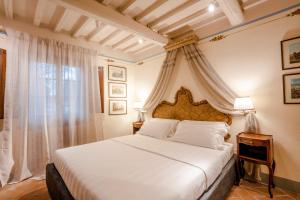 Postel nebo postele na pokoji v ubytování Equo Suites
