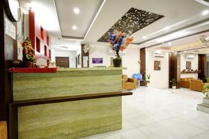 a lobby of a hospital with a reception counter at Hotel Claytone Near Delhi Airport in New Delhi