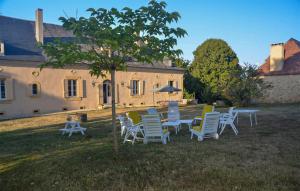 a group of chairs and tables in front of a house at 6 Bedroom Stunning Home In Saint-Agne in Saint Agne