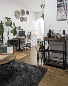 a living room with potted plants on the wall at 1 Bedroom Apartment East Village Union Square in New York