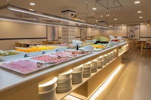 a buffet line with many different types of food at Medplaya Hotel Bali in Benalmádena