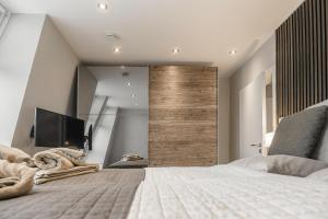 Postel nebo postele na pokoji v ubytování Beach House Penthousewohnung Düne