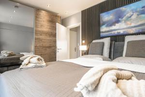 Postel nebo postele na pokoji v ubytování Beach House Penthousewohnung Düne