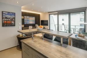 TV a/nebo společenská místnost v ubytování Beach House Penthousewohnung Düne