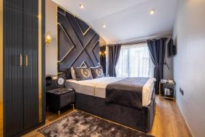 A bed or beds in a room at Wind Suit