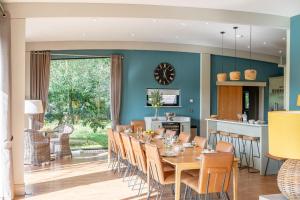 a dining room and kitchen with a table and chairs at Twenty One in Richmond