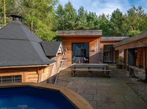 a backyard with a pool and a wooden house at Twenty One in Richmond