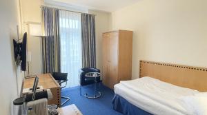 Postelja oz. postelje v sobi nastanitve GLANDON Rooms Elite