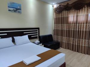 Ліжко або ліжка в номері H. V Hotel Bandara Gorontalo