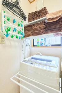 Postel nebo postele na pokoji v ubytování Comfy Home Koiwa