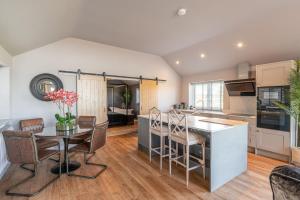 a kitchen and living room with a table and chairs at Bearskin Cottage in Leyburn +13 photos