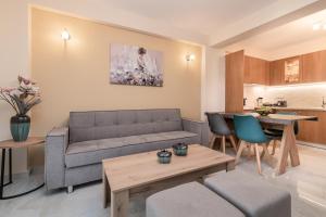 a living room with a couch and a table at Al Centro Zante city flat in Zakynthos