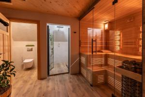 a bathroom with a shower and a toilet at Apartamenty i pokoje Pod Limbami - sauna, tężnia in Bukowina Tatrzańska