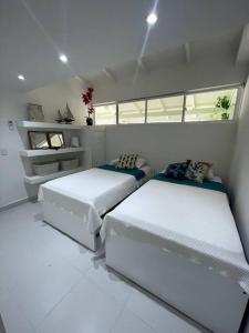 Llit o llits en una habitació de San Andrés , apartamento resort