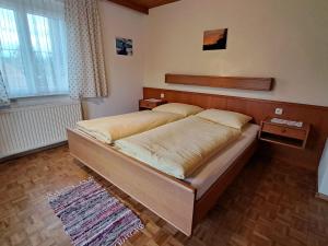 a bedroom with a large bed in a room at Apartment Waldfrieden by Interhome in Oberwang