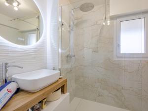 a bathroom with a sink and a shower at Apartment Royal Marine-2 by Interhome in Fréjus