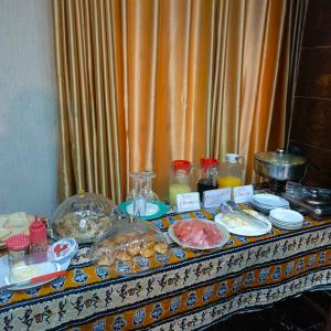 a table with some food on top at HOTEL MAVILLA Cotonou in Cotonou