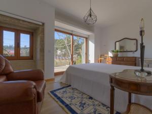 Postel nebo postele na pokoji v ubytování Holiday Home Pedra by Interhome