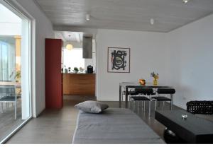 a living room with a table and a dining room at Villa Ermita in Puntagorda