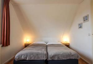 Cama ou camas em um quarto em Klein Giethoorn - Vakantiehuis 9