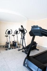 a gym with five exercise bikes in a room at Victoria bilocale centro città e vista mare in Menton