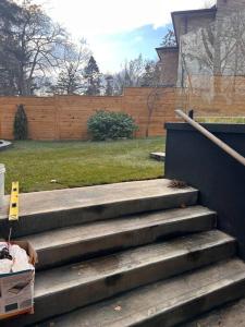 a set of stairs in a yard with a fence at Lakeshore aptMuskoka in the city in Mississauga