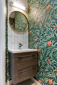 a bathroom with a sink and a mirror at Hestia House in Derry Londonderry