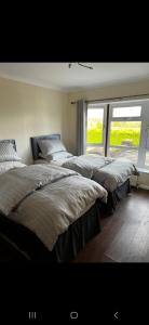 Een bed of bedden in een kamer bij Badgers rest lodge
