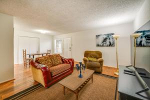 a living room with a couch and two chairs at Walkable Dallas Condo about 3 Mi to Downtown! in Dallas