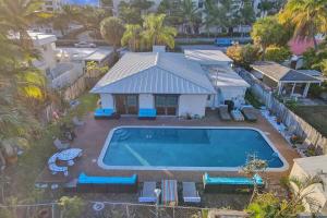 an aerial view of a house with a swimming pool at 5 Minute Walk to the Beach in Fort Lauderdale